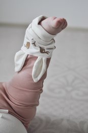 "Soft, cozy pink bunny pants for baby girls. Made of comfortable, stretchy material with a cute bunny design. Available in newborn to 18 months sizes."