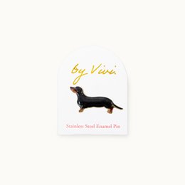  Dark-colored dachshund pin with a stylized design, suitable for kids' accessories.