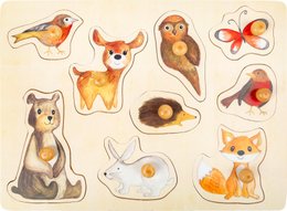 Wooden puzzle with forest animal shapes including a fox, owl, rabbit, and butterfly. The puzzle pieces feature various colors and textures representing the natural elements of the forest.