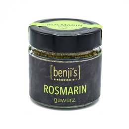 Dried rosemary spice in a glass jar. Earthy, aromatic seasoning for cooking and baking.