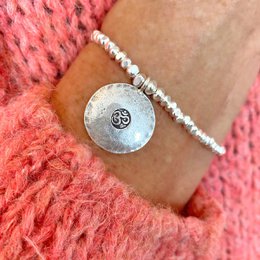 Meaningful silver bracelet with a large Om