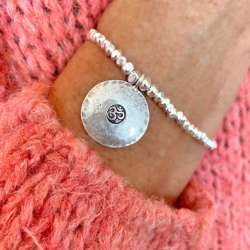 Meaningful silver bracelet with a large Om