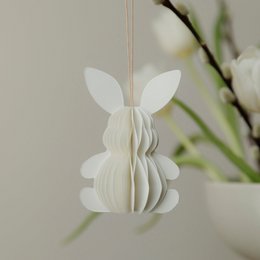  White paper pendant in the shape of a rabbit, perfect for Easter decoration.