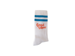 White socks with "Good Vibes" text and blue stripes