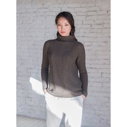  Cozy brown sweater with a high collar and long sleeves, perfect for layering during the colder months.
