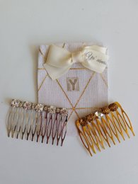 Elegant gold and silver hair combs with decorative designs, suitable for formal or casual hairstyles.