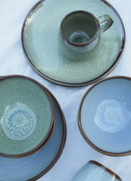 Set of 6 green ceramic dinner plates with a subtle textured pattern.