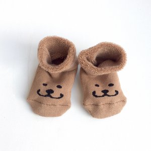 Weiche Kamelbabyschuhe das Lächeln von Brom
