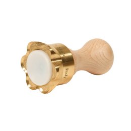  Brass ravioli-cutting mold with flower-shaped design, suitable for pasta making.