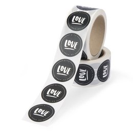 Black and white stickers with the text "Love" printed on them, arranged in a roll.

The product is a roll of 500 black and white stickers with the text "Love" printed on them. The stickers have a simple, minimalist design with the word "Love" in a handwritten-style font against a contrasting background. These stickers could be used for various purposes, such as decorating, scrapbooking, or adding a personal touch to various items.