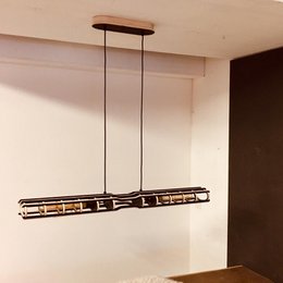 A modern, semi-black pendant lighting fixture with a rectangular shape and linear design. The fixture features a sleek, minimalist style that would complement a variety of interior decor styles.