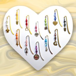 12 metal pendant silver bookmarks in various colors and designs, including charms and pendants.