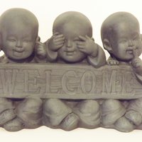 Hear-see-shut up "welcome" child monks garden statue