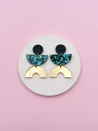  Turquoise butterfly drop earrings with gold arch shape, geometric design, colorful statement jewelry.