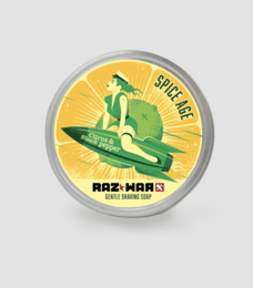 Organic Spice Age shaving soap with a green and yellow label featuring a surfer design. The soap is in a round container.