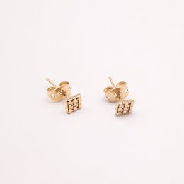 Square gold-toned stud earrings with a textured surface.