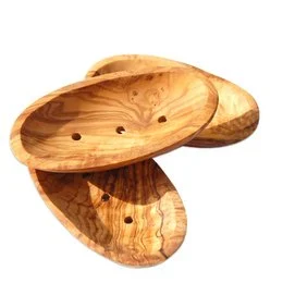 Oval wooden soap dish with groove on the back, approximately 12-14 cm in size.
