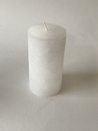 Rustic white pillar candle, 70 x 130 mm in size, made of wax.