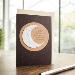 A greeting card with a crescent moon design and a comforting message for someone who is grieving the loss of a loved one.
