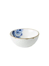 A round, shallow ceramic dish with a blue floral design. The dish appears to be a sauce boat or small serving bowl.