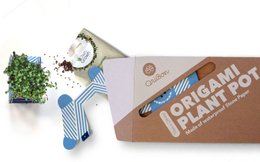 A round, tall ceramic plant pot in a classic design with a blue and white striped pattern. The pot is made of high-quality materials and is suitable for indoor or outdoor use.