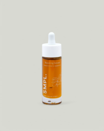 Boosting serum with amber-colored liquid in a glass bottle with dropper. Suitable for facial skin care.