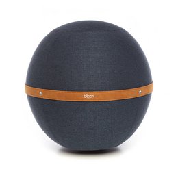  A large, round, dark gray pouf with an orange accent band. The pouf is placed in a modern, minimalist home office setting with a white desk, wooden accents, and potted plants.