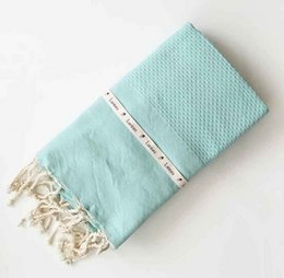 Mint-colored hammam towel with a waffle texture, measuring 100x200cm, suitable for use as a beach towel or bath towel.