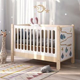  A transforming children's bed made of wood with a neutral color scheme, featuring adjustable slats and various hanging decorations like raindrops and animals. The bed can grow with the child as they age.