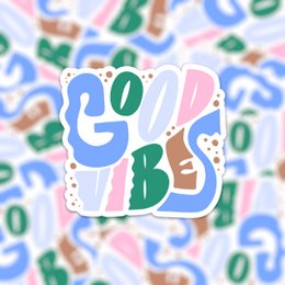 Colorful vinyl sticker with the text "Good Vibes" in a playful, artistic design.