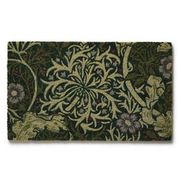A decorative coir doormat featuring a floral pattern in shades of green and black. The design includes stylized flowers, leaves, and other botanical elements.