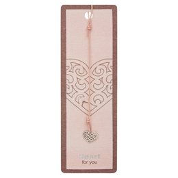 Stainless steel bookmark with heart-shaped charm, pink and brown color scheme, decorative swirls, and inspirational text "Listen to your heart and follow your dreams".