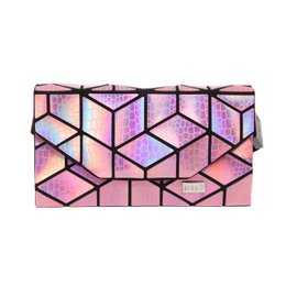 A pink and purple geometric patterned bum bag with a snake design.