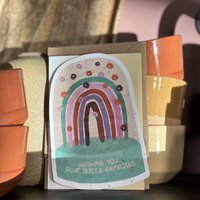 Send & Grow postcard - Blue skies and rainbows