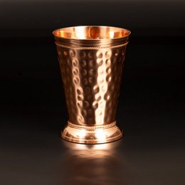  Hammered copper cocktail mug with a Roman-style design, holding 300ml.