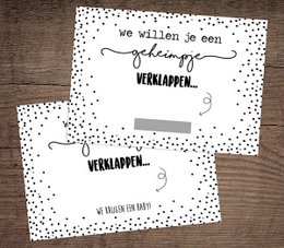 Scratch cards with the text "We're Having a Baby" in a playful, hand-drawn style with polka dot accents. Suitable for baby shower or pregnancy announcement cards.
