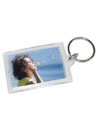 A set of 100 assorted key rings in a display case. The key rings feature a variety of designs and colors, making them suitable for personal use or as promotional items.