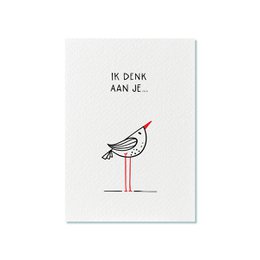A simple, minimalist postcard with a hand-drawn illustration of a bird and the text "Ik denk aan je" (I'm thinking of you) in Dutch. The postcard is suitable for sending a thoughtful message to someone.