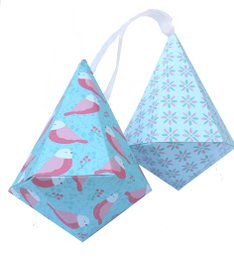 Colorful DIY Christmas baubles with a geometric pattern and pink flamingo design. Suitable for crafting and decorating.