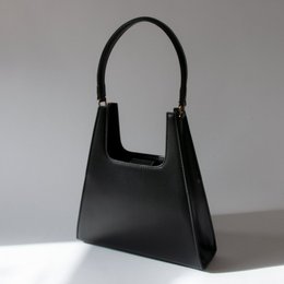 Black leather handbag with a structured, rectangular shape and two top handles.