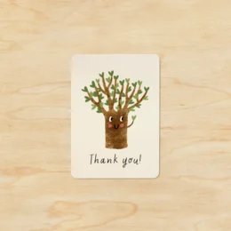 A small thank you card with a hand-drawn tree illustration and the text "Thank you!" The card has a simple, minimalist design with a neutral color palette, making it suitable for a variety of occasions.
