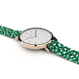 A stylish watch with a rose gold case and a green patterned strap, featuring a classic analog display.