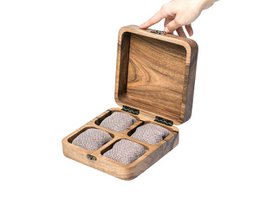  A wooden watch storage box made of European walnut, with compartments to hold 4 to 12 watches. The box features a rustic, natural wood design and a metal clasp closure.