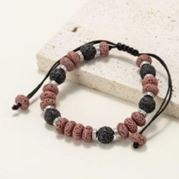  Bracelets made of round and flat beads in natural lava stone tinted red and black.