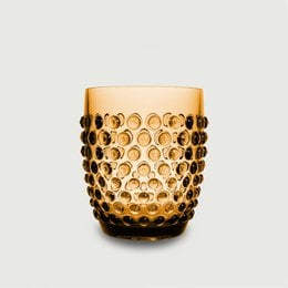 Amber-colored acrylic drinking cup with a dotted pattern, lightweight and unbreakable, suitable for outdoor use like gardens and picnics.