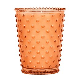 A tall, round glass candle in a chestnut color with a hobnail texture and pattern. The candle has a rustic, vintage-inspired design.