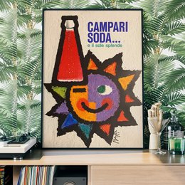 Vibrant poster featuring a colorful sun-like design and the Campari Soda logo. The poster has a retro, abstract style with bold shapes and colors, creating an eye-catching and visually appealing design.