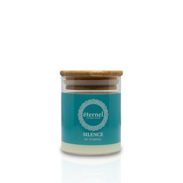 Aroma candle "Silence" - a tall, round candle with a teal-colored glass container and a wooden lid. The candle has a soothing, calming scent.