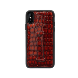 Brown leather iPhone case with crocodile-embossed pattern and finger strap.