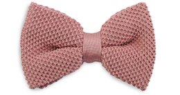 A soft pink knitted bow tie with a textured pattern, suitable for formal or casual wear.